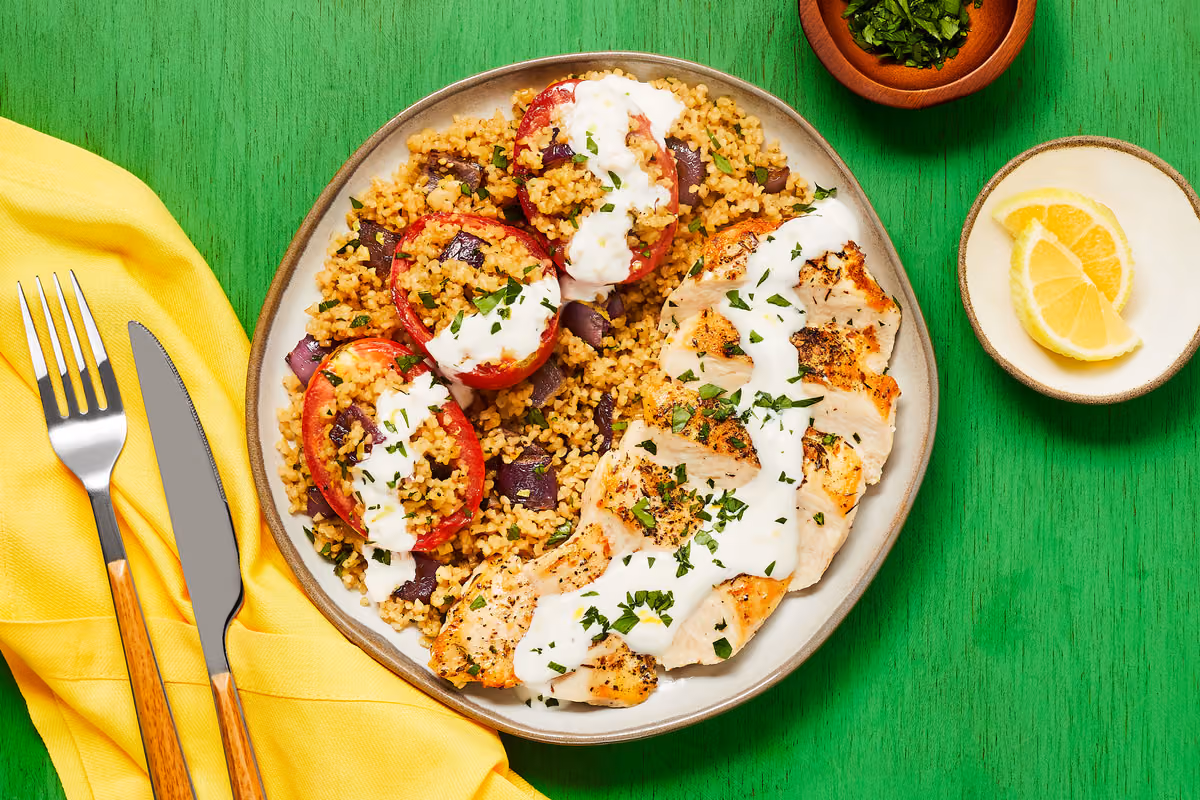 Za’atar-Spiced Chicken: Bulgur-Stuffed Roasted Tomatoes & Lemon Garlic Yogurt Sauce