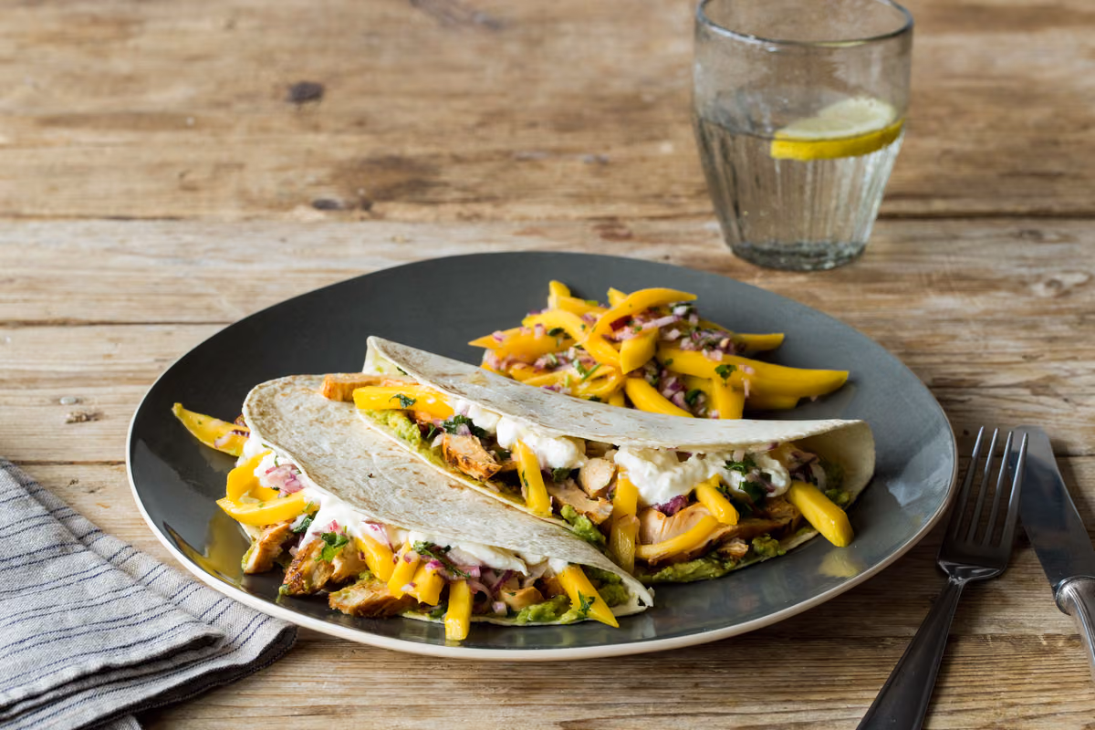 Smoky Adobo Chicken Tacos: Mango Slaw & Lime Crema
