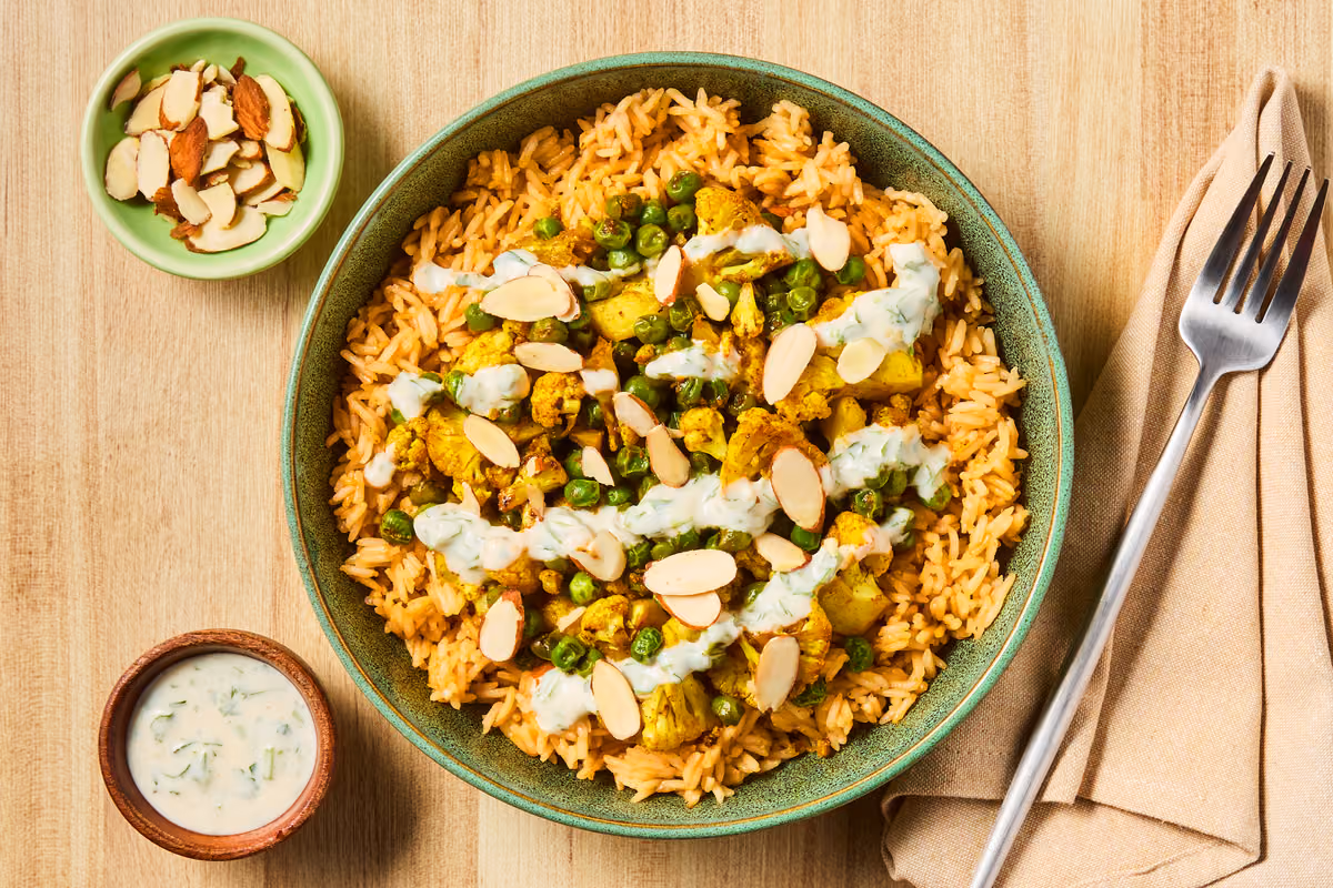 Middle Eastern-Spiced Cauliflower Bowl: Rice, Peas & Cilantro-Cumin Yogurt Sauce